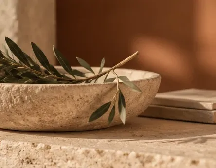 Stone bowl with an olive branch